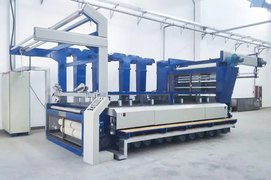 A Jiangsu Huayi sueding machine on a mill floor